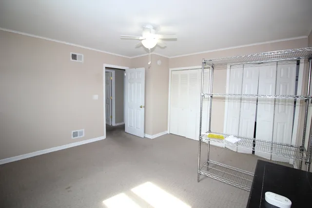 a view of an empty room with a window