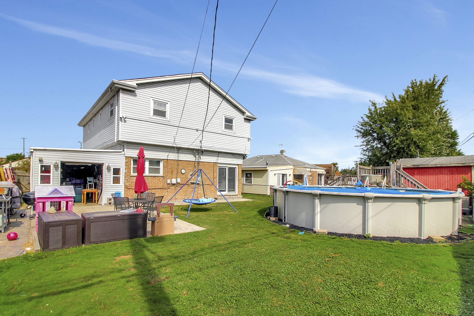 8001 South Kilpatrick Avenue Chicago, IL 60652 - Photo 25 of 25 a view of a house with a backyard and a patio