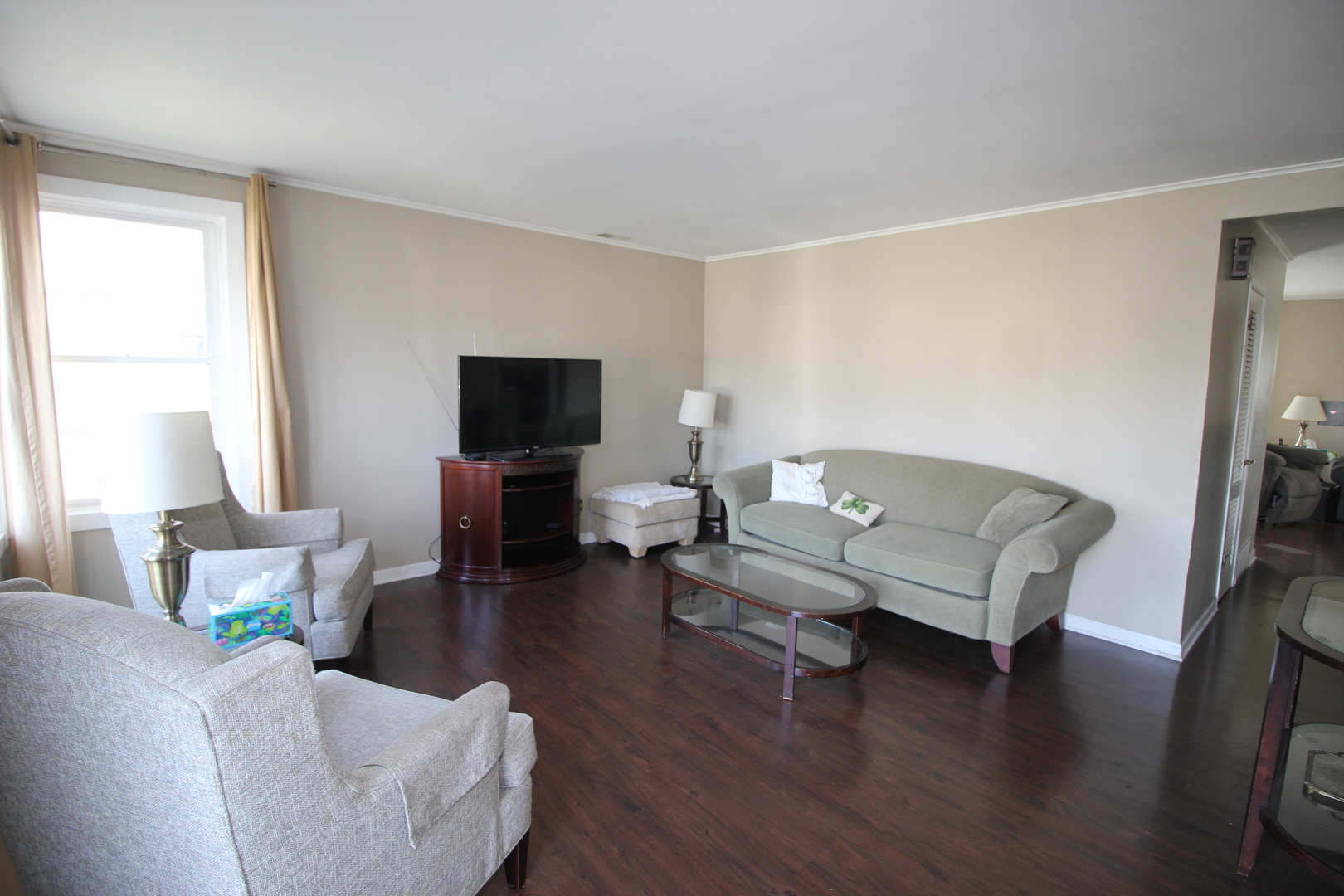 8001 South Kilpatrick Avenue Chicago, IL 60652 - Photo 4 of 25 a living room with furniture and a flat screen tv