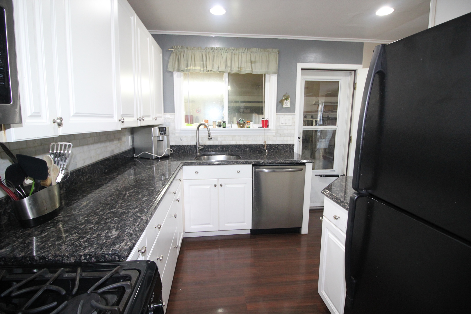 8001 South Kilpatrick Avenue Chicago, IL 60652 - Photo 9 of 25 a kitchen with a sink stove and refrigerator