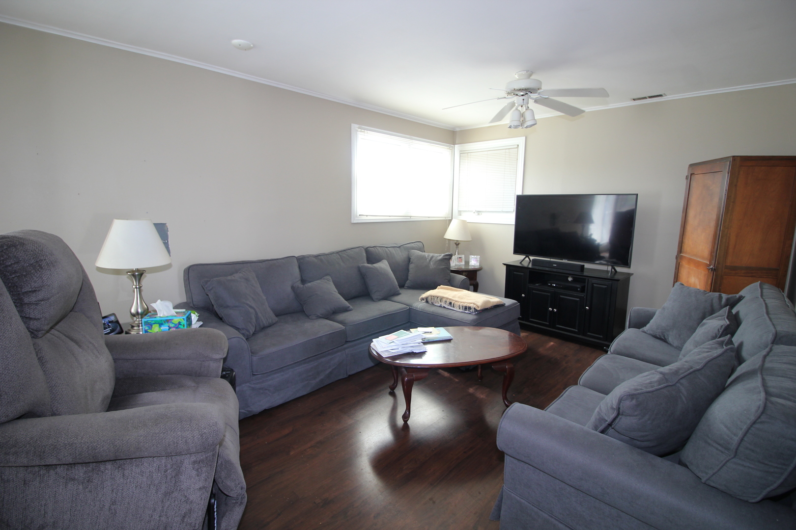 8001 South Kilpatrick Avenue Chicago, IL 60652 - Photo 10 of 25 a living room with furniture and a flat screen tv