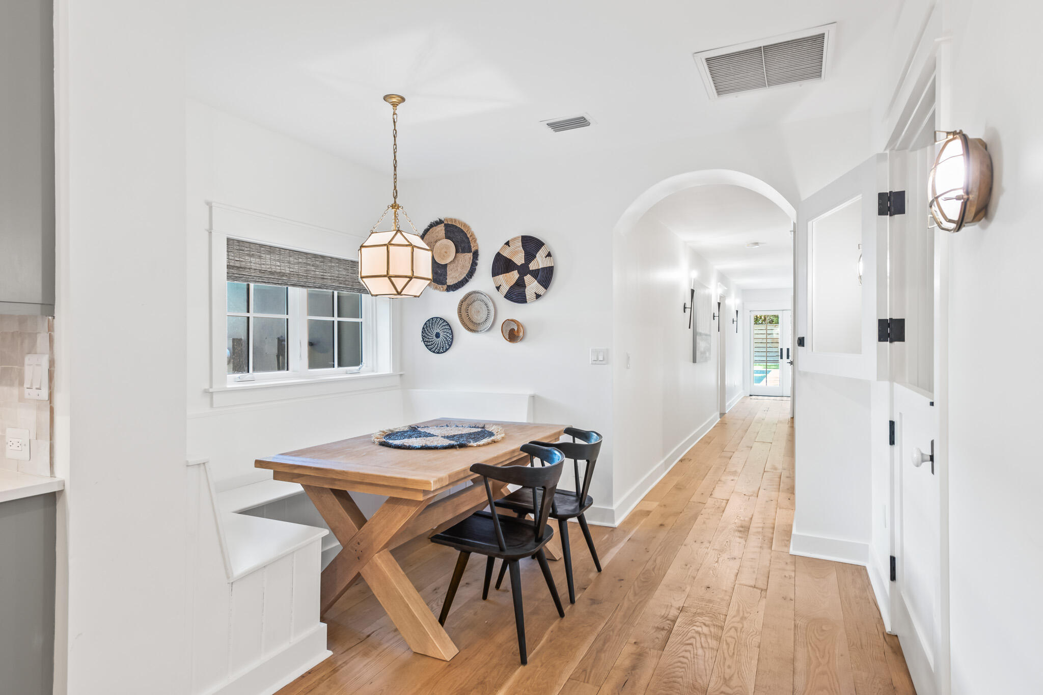 375 Defuniak Street Santa Rosa Beach, FL 32459 - Photo 23 of 94 a view of a dining room with furniture window and wooden floor