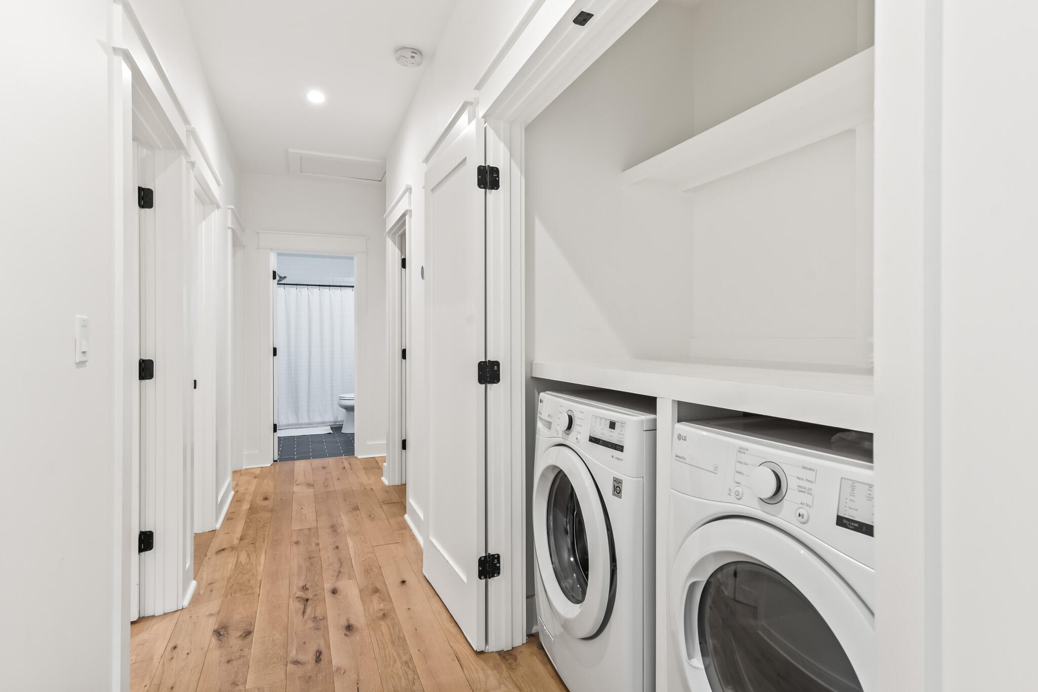 375 Defuniak Street Santa Rosa Beach, FL 32459 - Photo 55 of 94 a view of a hallway with washer and dryer