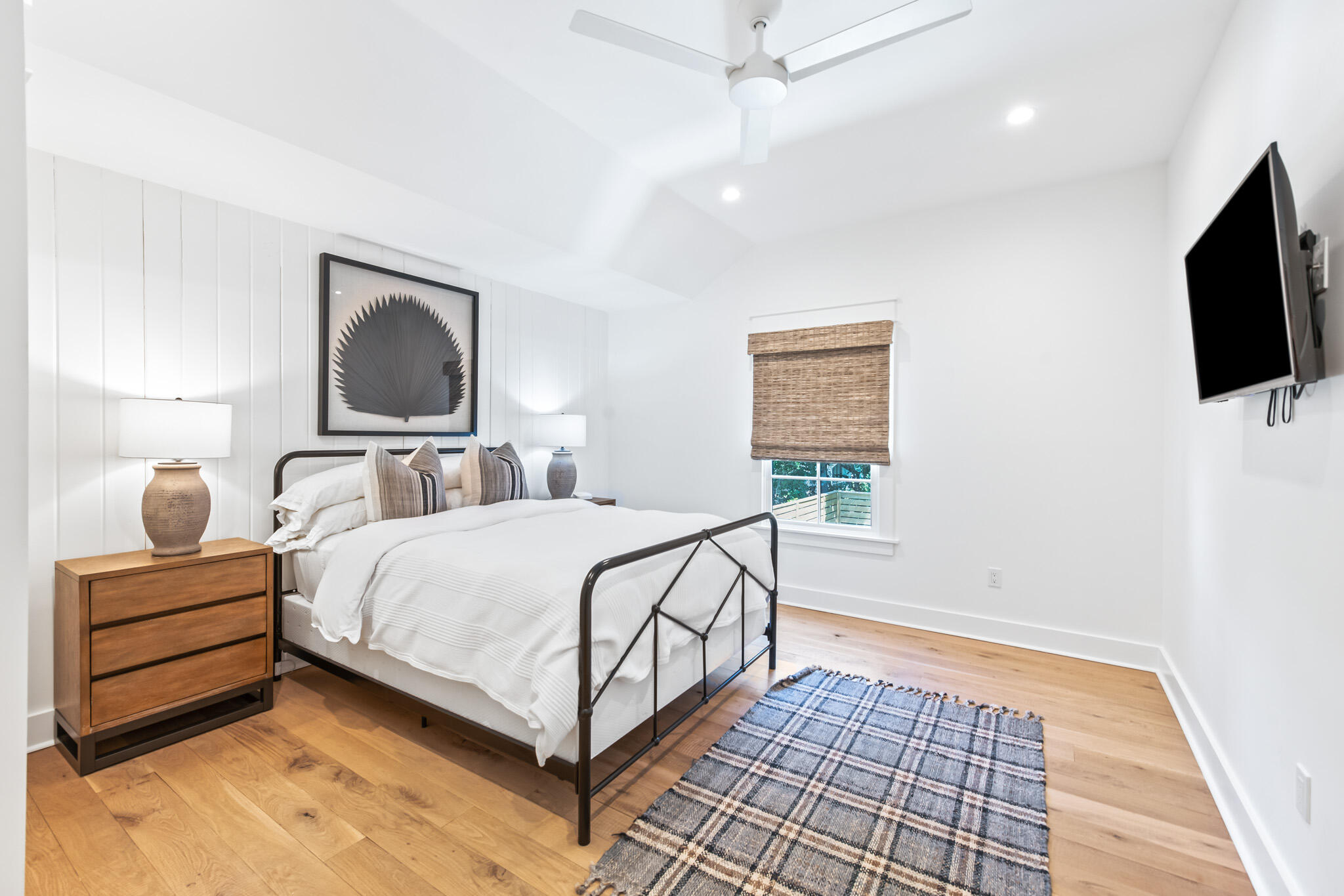 375 Defuniak Street Santa Rosa Beach, FL 32459 - Photo 61 of 94 a bedroom with a bed and a flat screen tv