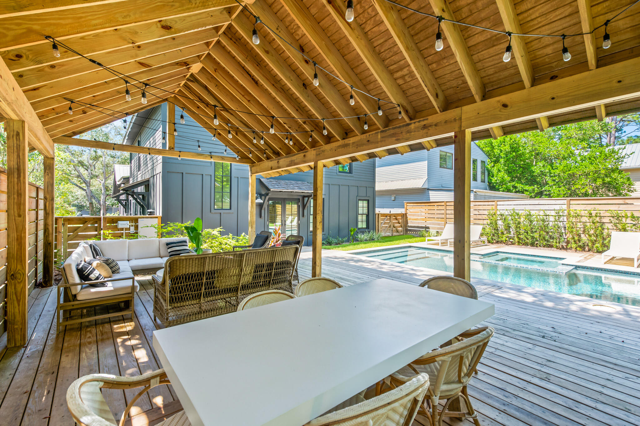 375 Defuniak Street Santa Rosa Beach, FL 32459 - Photo 69 of 94 a view of a patio with table and chairs and wooden floor