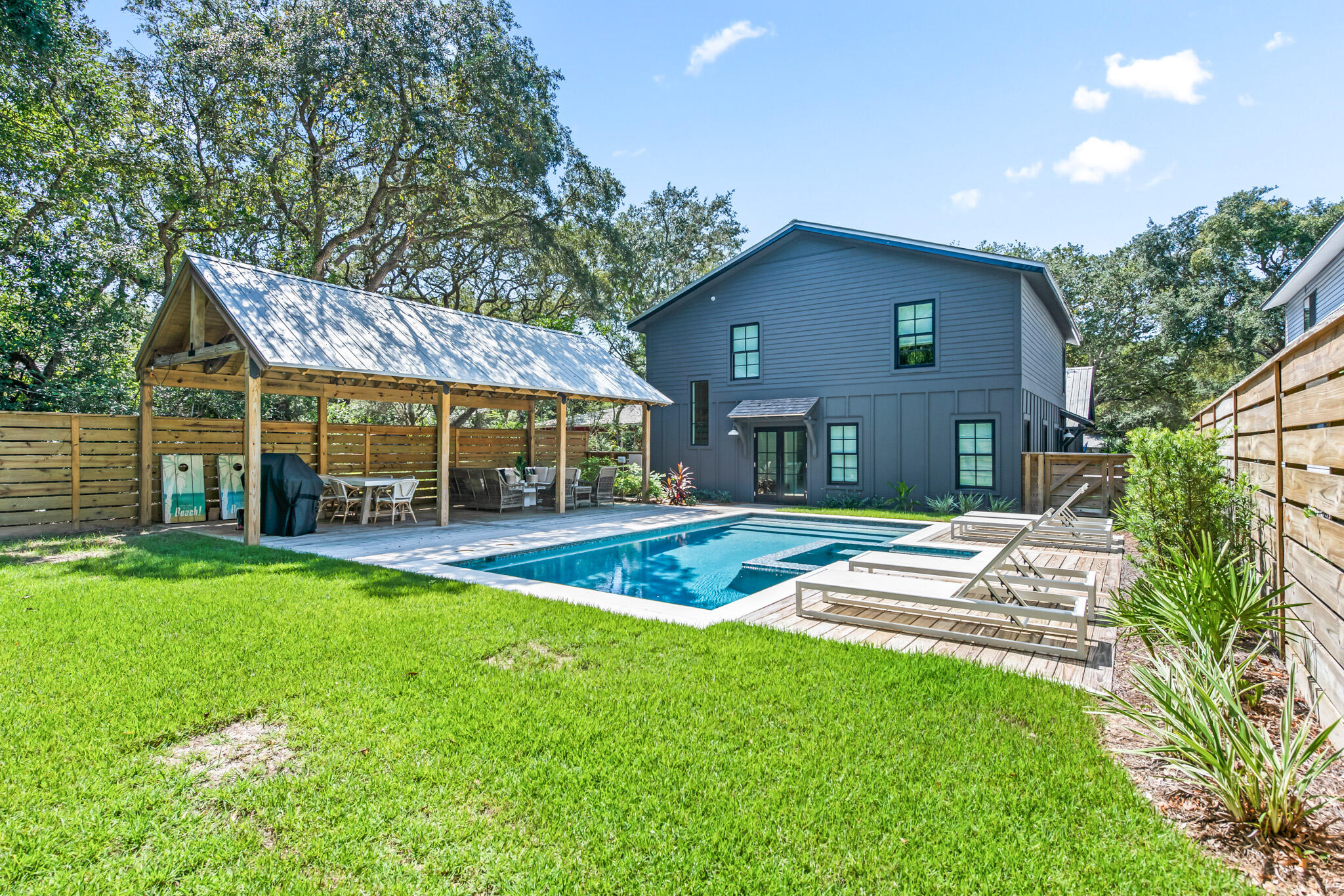 375 Defuniak Street Santa Rosa Beach, FL 32459 - Photo 70 of 94 a view of a house with a yard patio and a garden