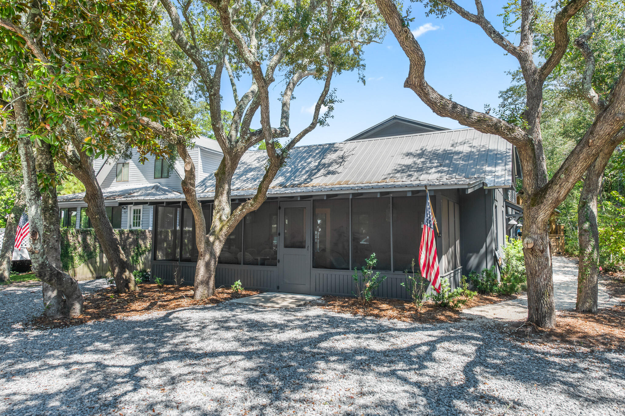 375 Defuniak Street Santa Rosa Beach, FL 32459 - Photo 81 of 94 a view of a house with a tree and wooden fence