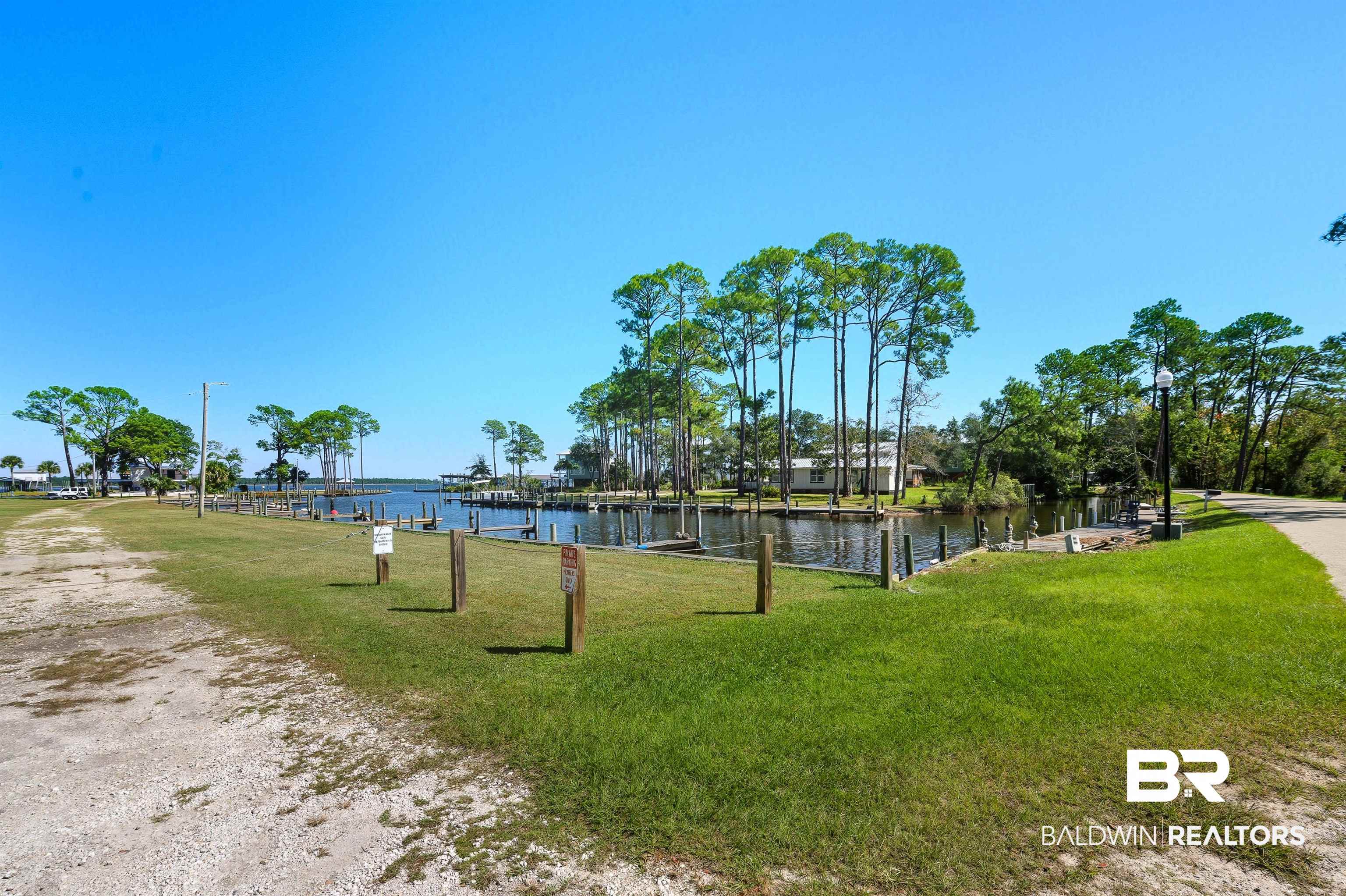 5310 Pine Road Orange Beach, AL 36561 - Photo 20 of 46 Surrounding community featuring a lawn and a water view