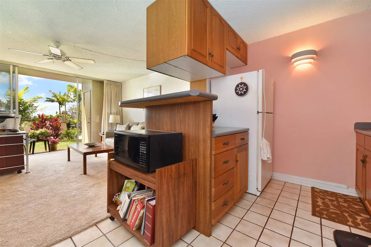 120 Hui Rd F, Unit B5 Lahaina, HI 96761 - Photo 14 of 28 a living room with furniture and a flat screen tv