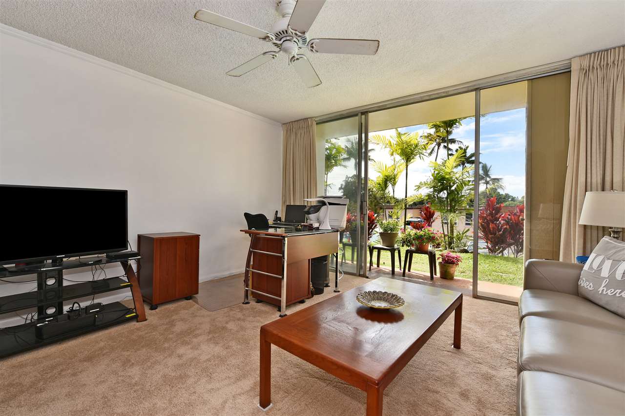 120 Hui Rd F, Unit B5 Lahaina, HI 96761 - Photo 24 of 28 a living room with furniture and a flat screen tv