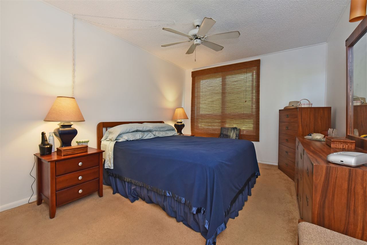 120 Hui Rd F, Unit B5 Lahaina, HI 96761 - Photo 4 of 28 a bedroom with a bed dresser and a window