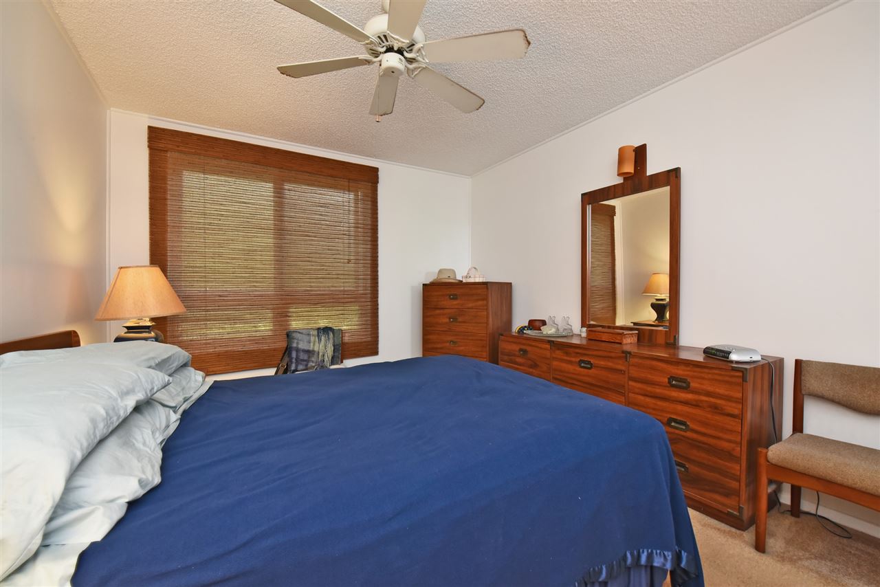 120 Hui Rd F, Unit B5 Lahaina, HI 96761 - Photo 5 of 28 a bedroom with a bed and wooden floor