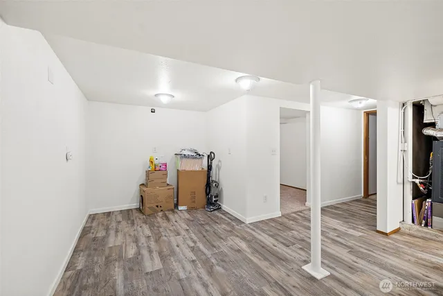 a view of a room with wooden floor