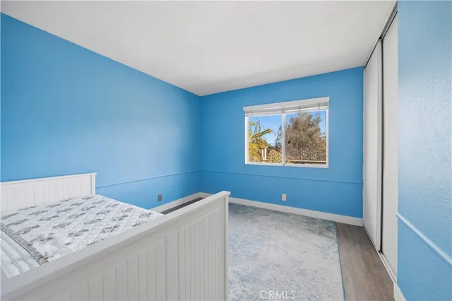 a bedroom with a bed and a bathroom