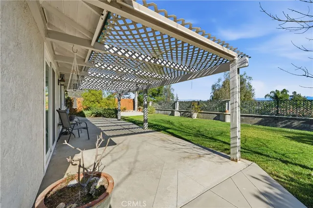 a view of a porch with furniture and garden