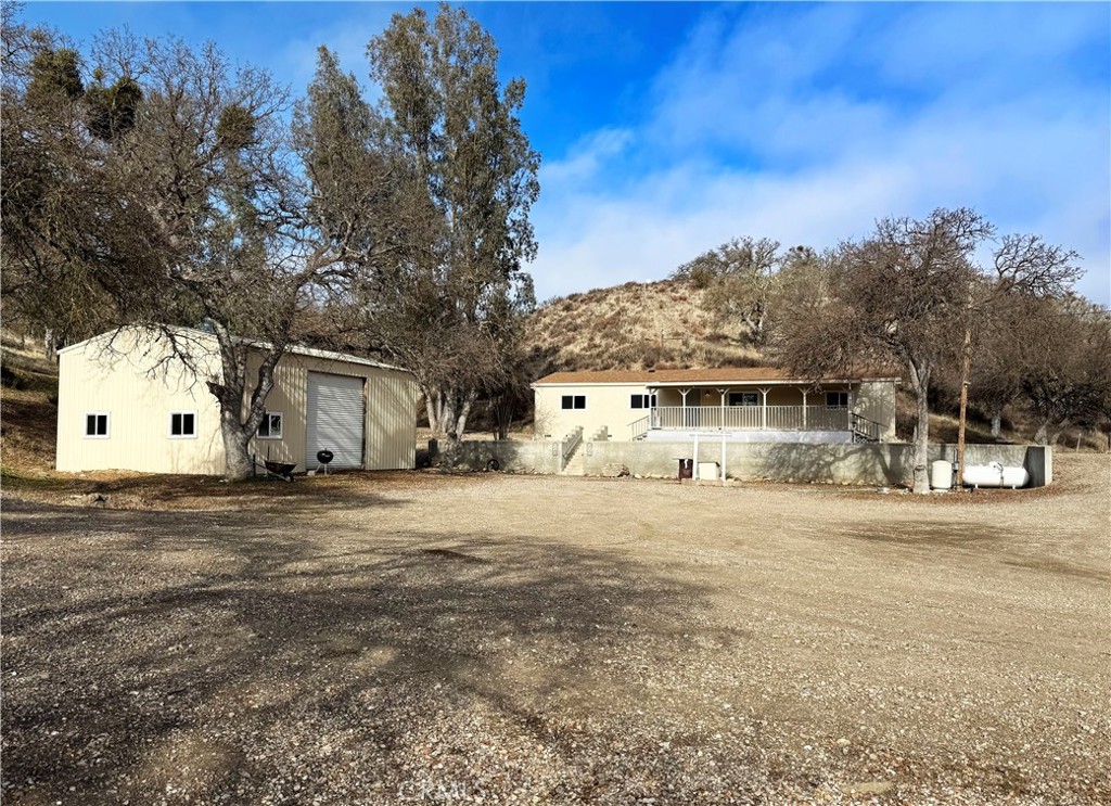 64512 Davis Canyon Road King City, CA 93930 - Photo 1 of 1 a big house with a big yard and large trees
