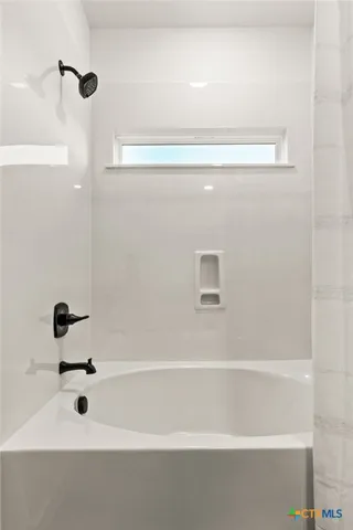 a bathroom with a bathtub