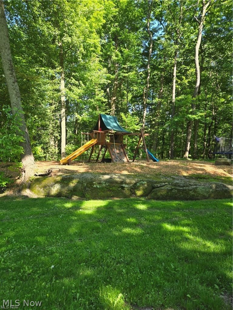 13725 Rockhaven Road Newbury, OH 44065 - Photo 28 of 31 Well equipped playground sitting above a boulder wall