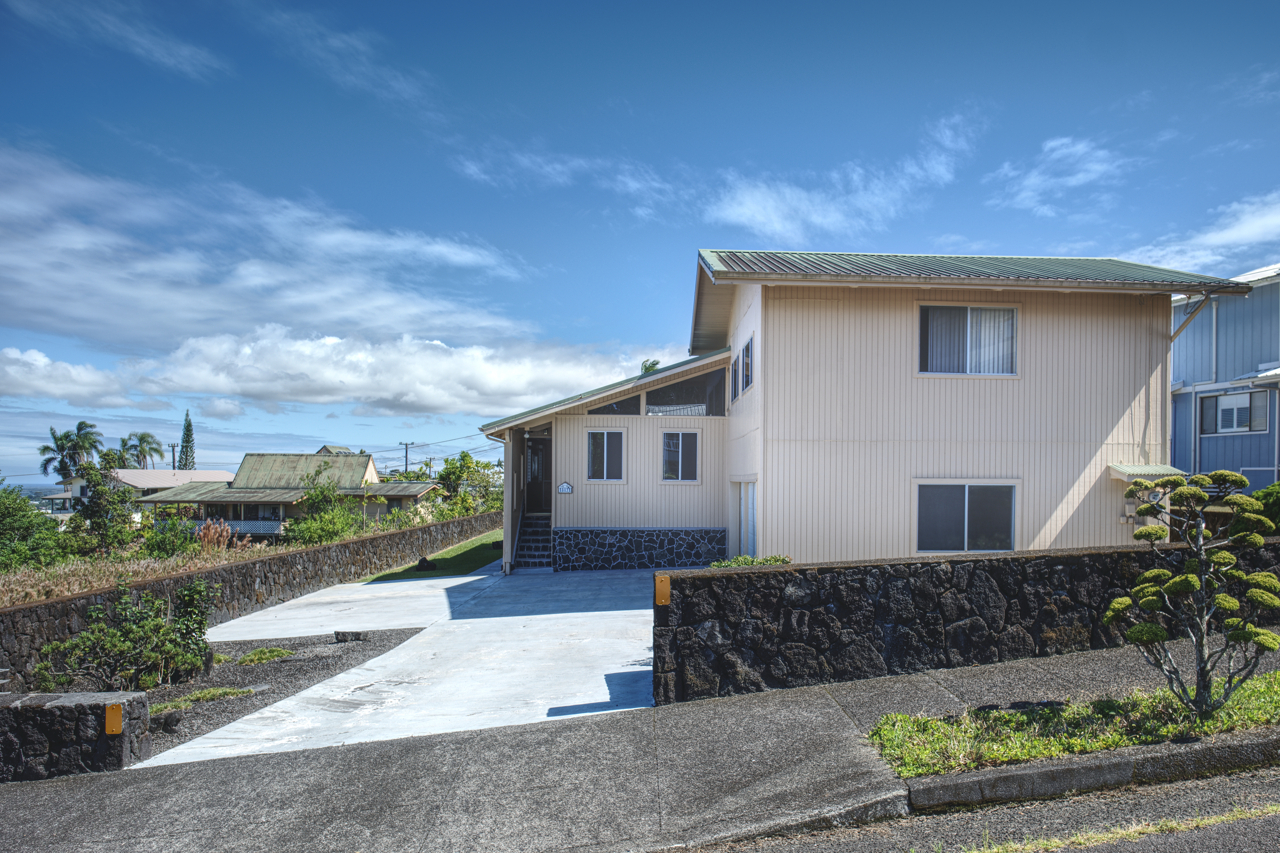 883 Hele Mauna Street Hilo, HI 96720 - Photo 26 of 26 a front view of a house with a yard