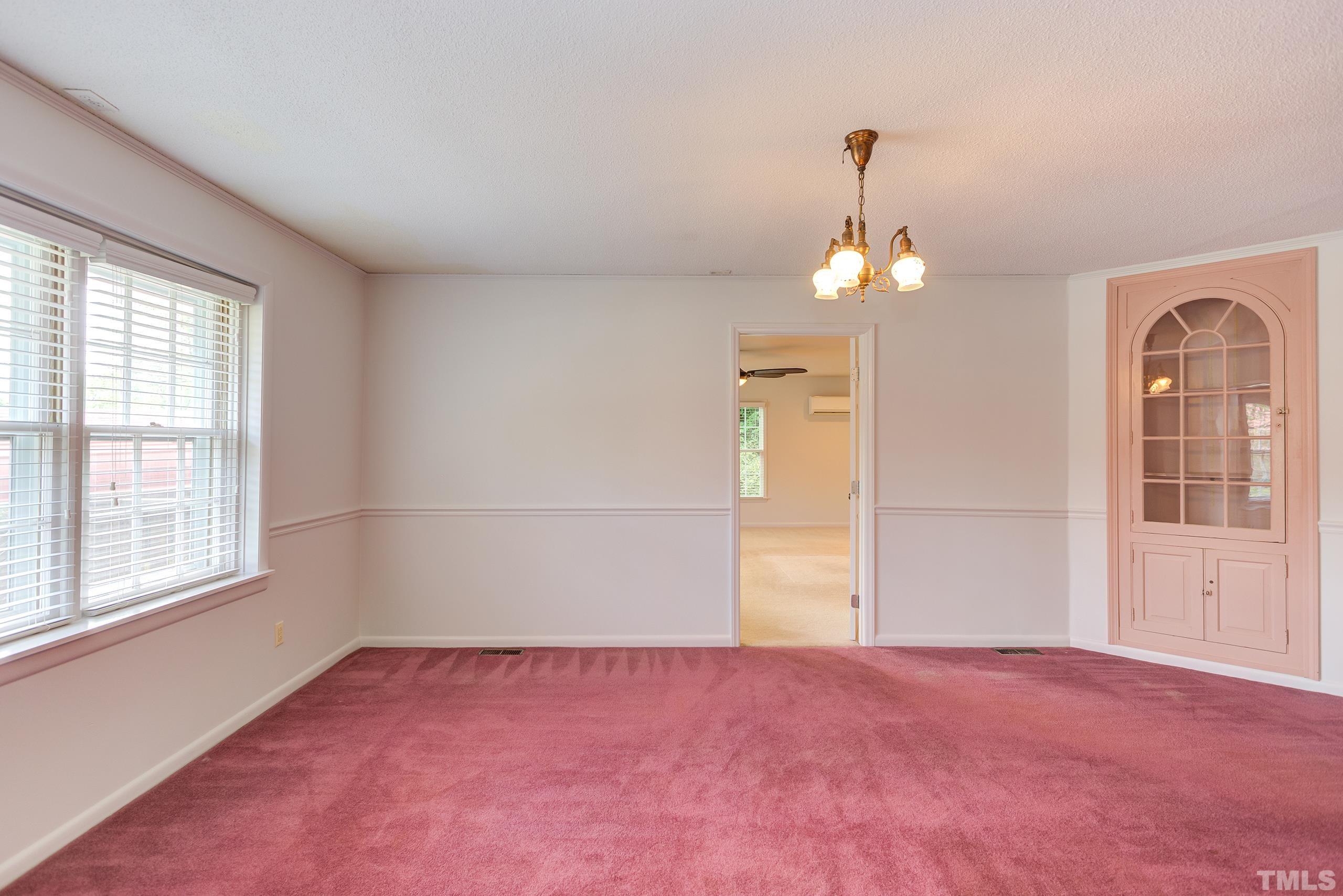 2312 Gresham Lake Road Raleigh, NC 27615 - Photo 11 of 46 wooden floor in an empty room with a window