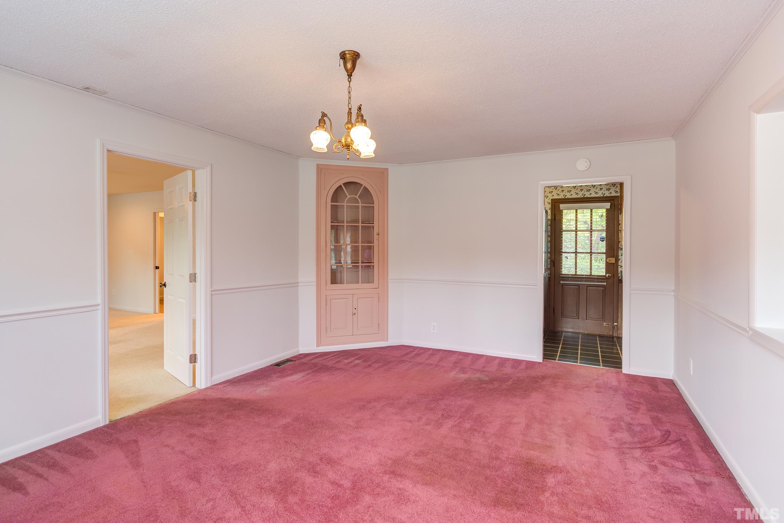 2312 Gresham Lake Road Raleigh, NC 27615 - Photo 13 of 46 a bedroom with a bed and a window
