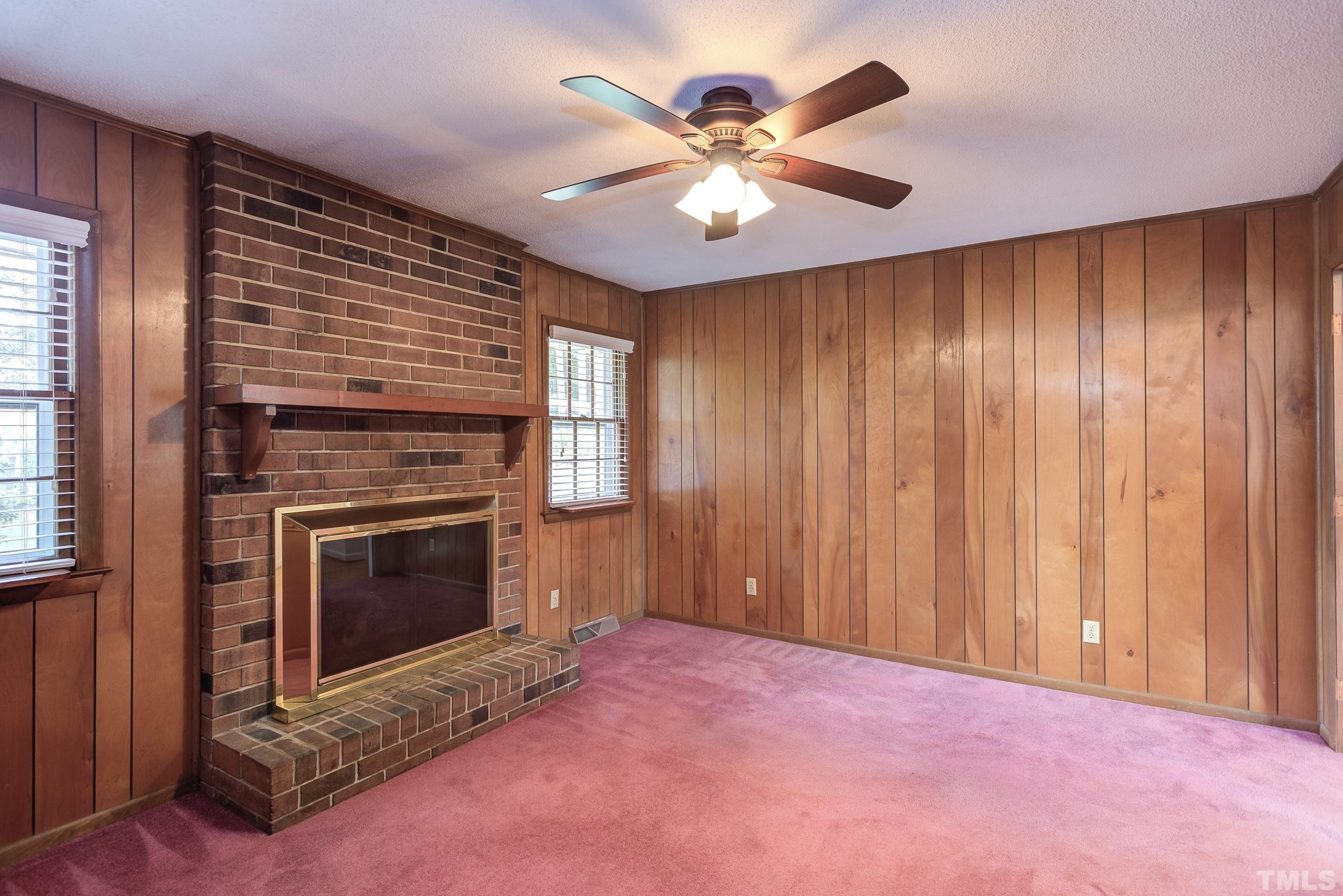 2312 Gresham Lake Road Raleigh, NC 27615 - Photo 15 of 46 a view of empty room with kitchen and fireplace