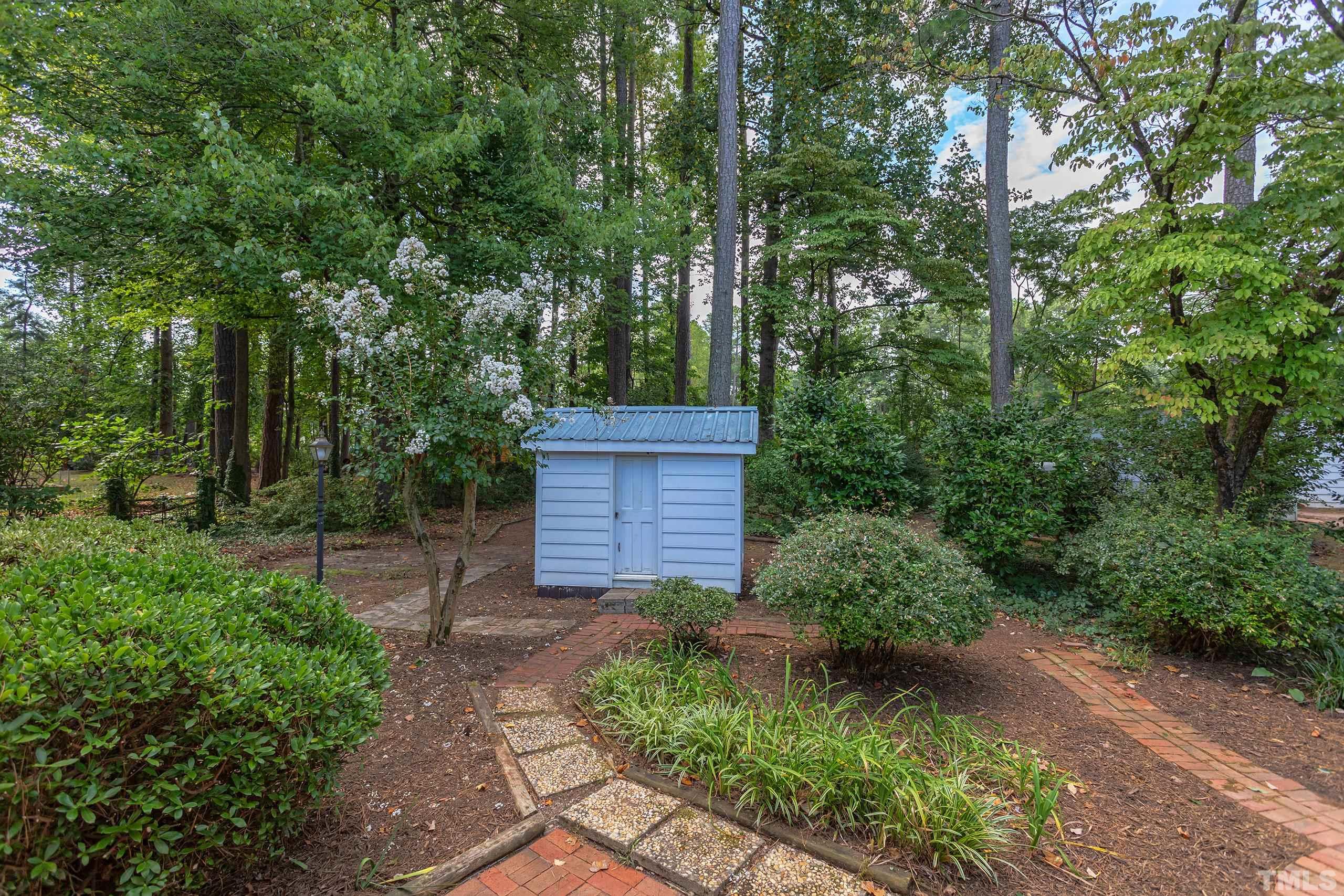 2312 Gresham Lake Road Raleigh, NC 27615 - Photo 34 of 46 a view of a pathway of a yard