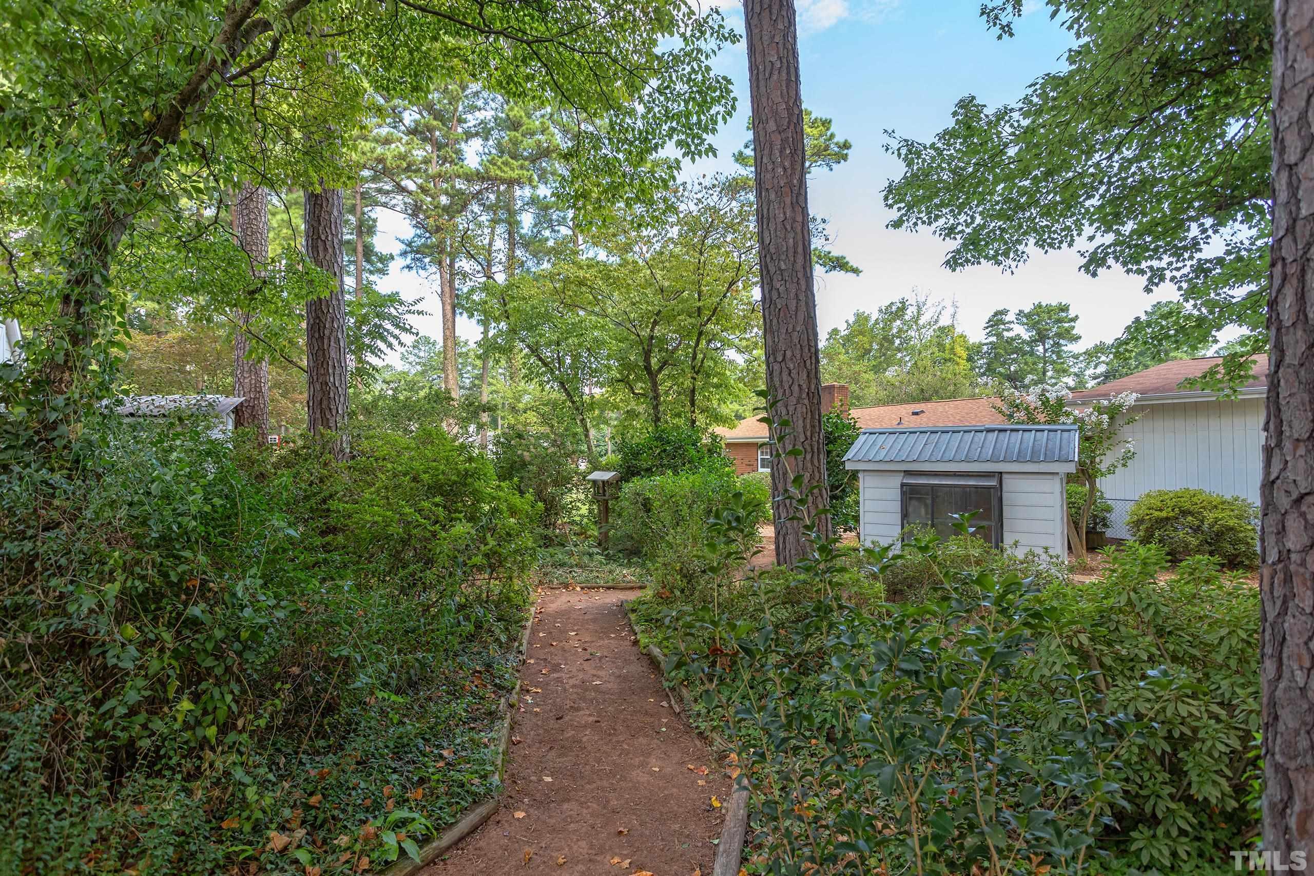2312 Gresham Lake Road Raleigh, NC 27615 - Photo 36 of 46 a view of a pathway in outside of the house