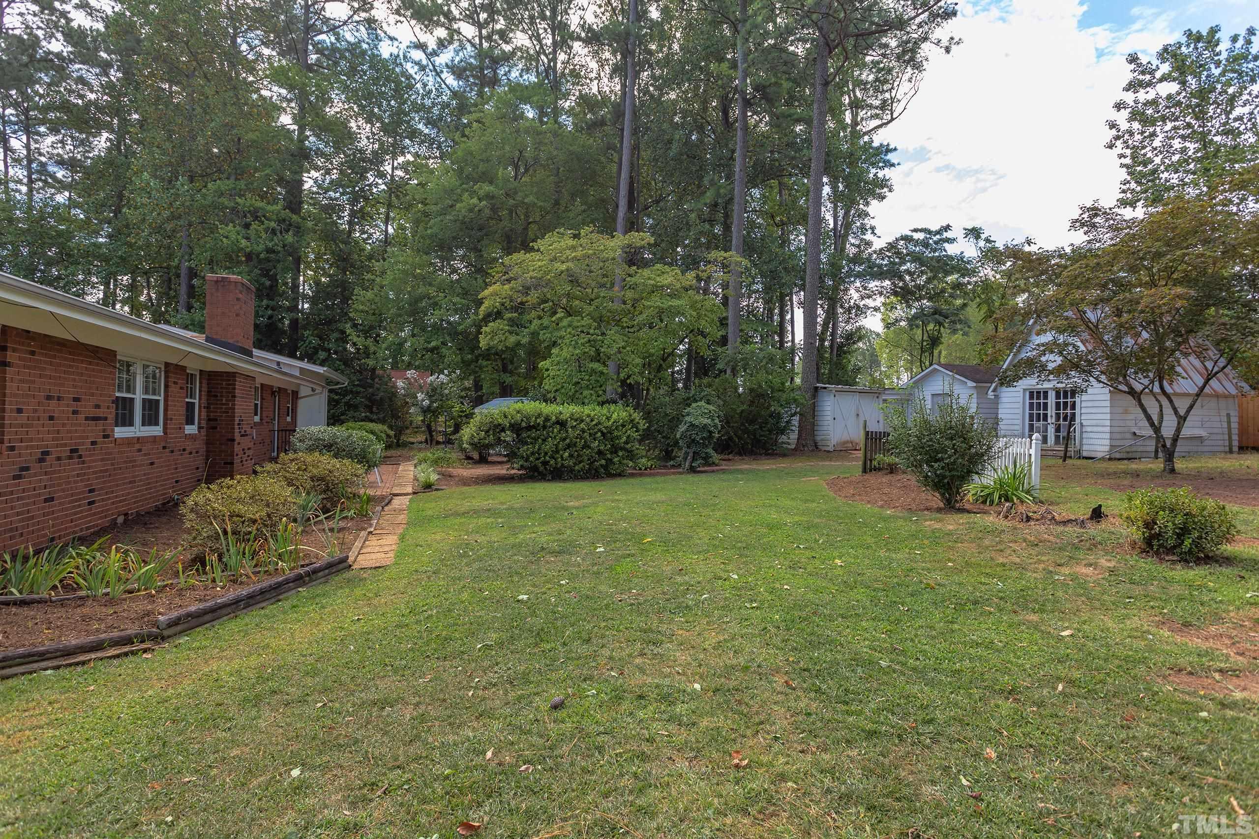 2312 Gresham Lake Road Raleigh, NC 27615 - Photo 40 of 46 front view of a house with a yard