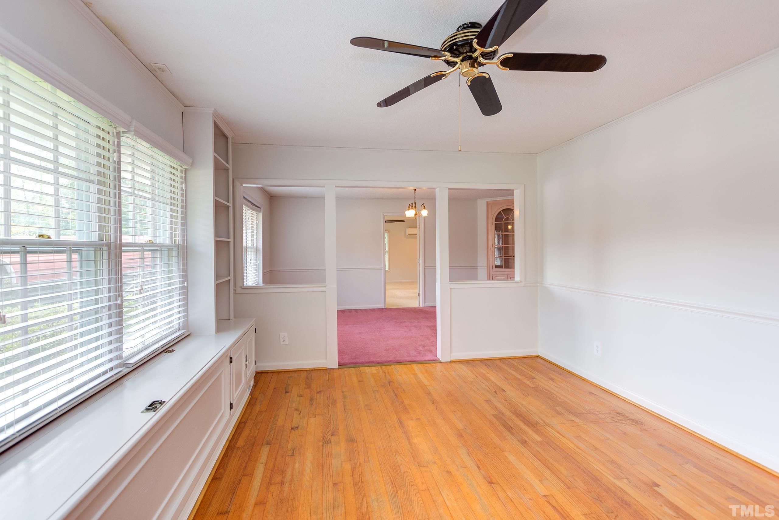 2312 Gresham Lake Road Raleigh, NC 27615 - Photo 10 of 46 a bedroom with a bed and a chandelier fan