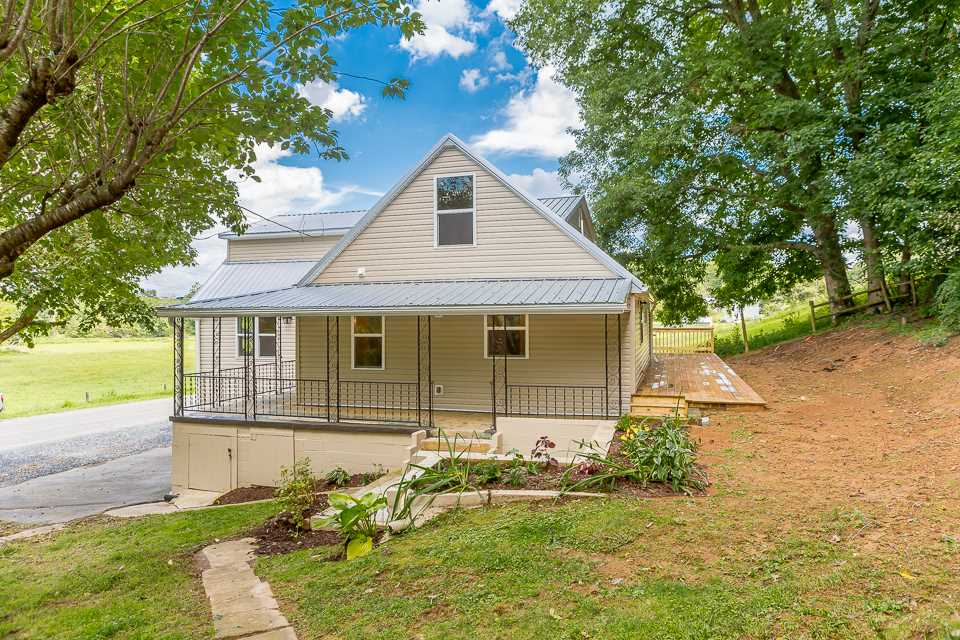 450 Whitmore Road Mount Solon, VA 22843 - Photo 1 of 43 a front view of a house with a yard