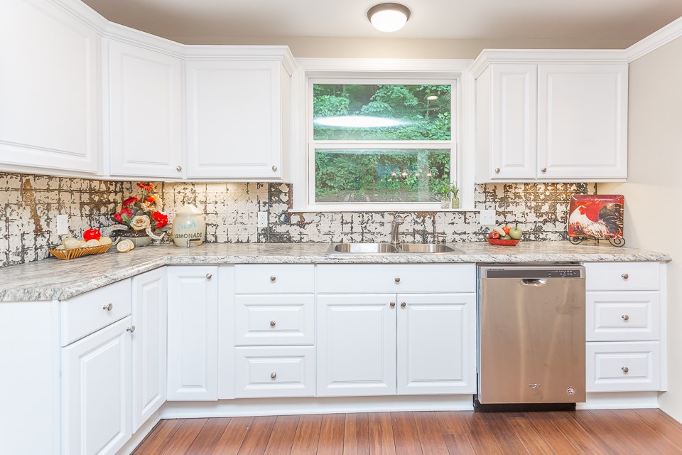 450 Whitmore Road Mount Solon, VA 22843 - Photo 15 of 43 a kitchen with white cabinets and window