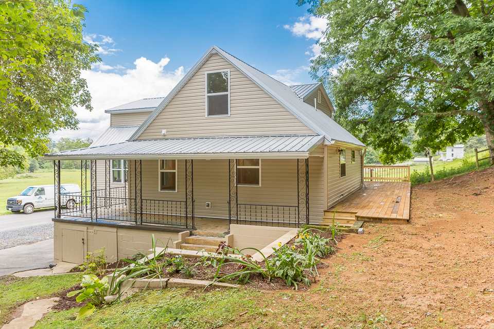 450 Whitmore Road Mount Solon, VA 22843 - Photo 2 of 43 a front view of a house with a yard