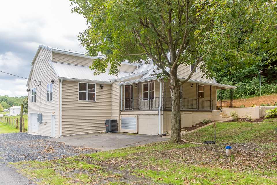 450 Whitmore Road Mount Solon, VA 22843 - Photo 42 of 43 a front view of a house with a yard and garage
