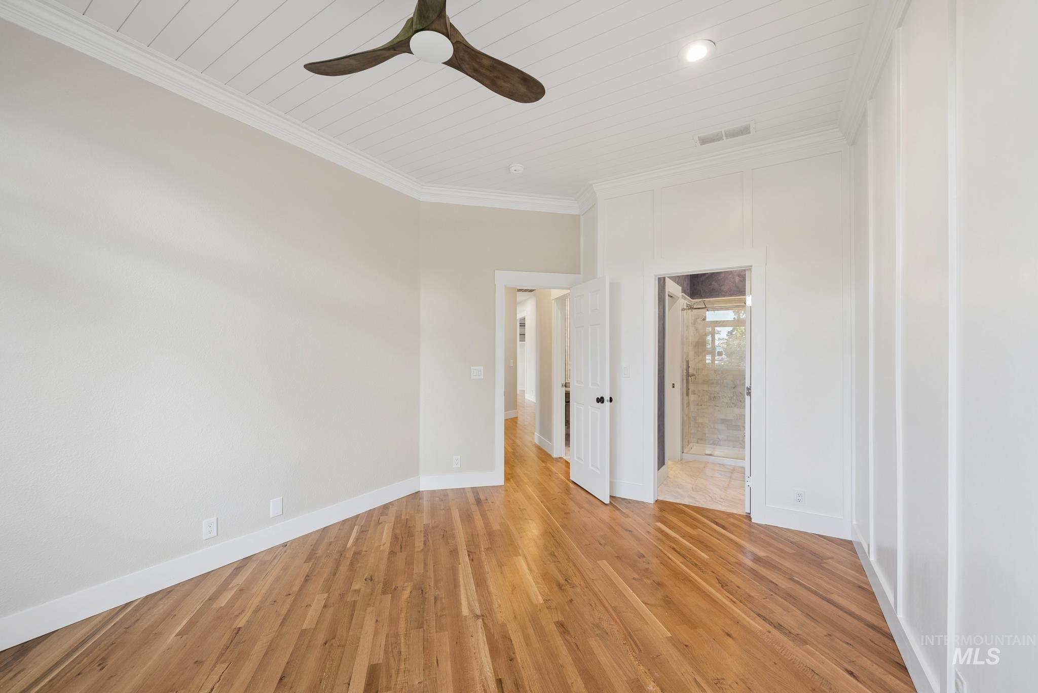 2050 Artesian Road Eagle, ID 83616 - Photo 41 of 49 Hardwood flooring and shiplap ceiling with a ceiling fan