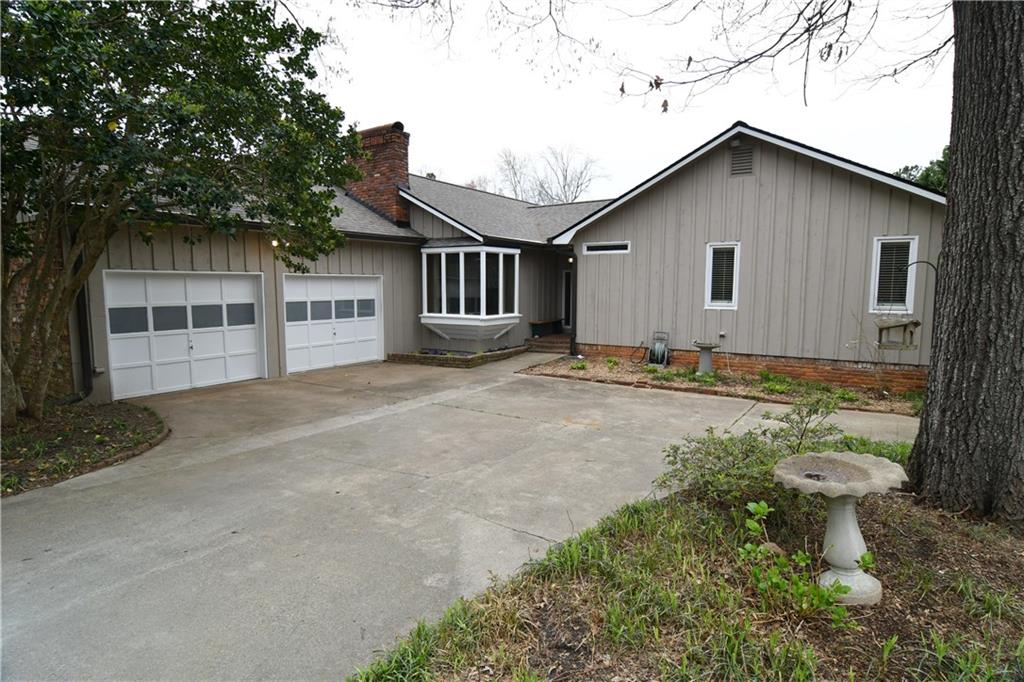 Welcome to 3386 Ebenezer Road.  There is additional parking to the left of the tree by the garage.