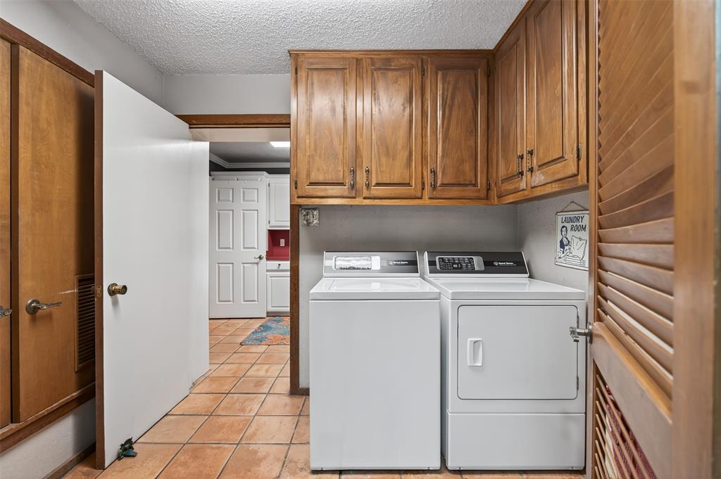 3030 Wager Road Flower Mound, TX 75028 - Photo 18 of 39 a utility room with dryer and washer