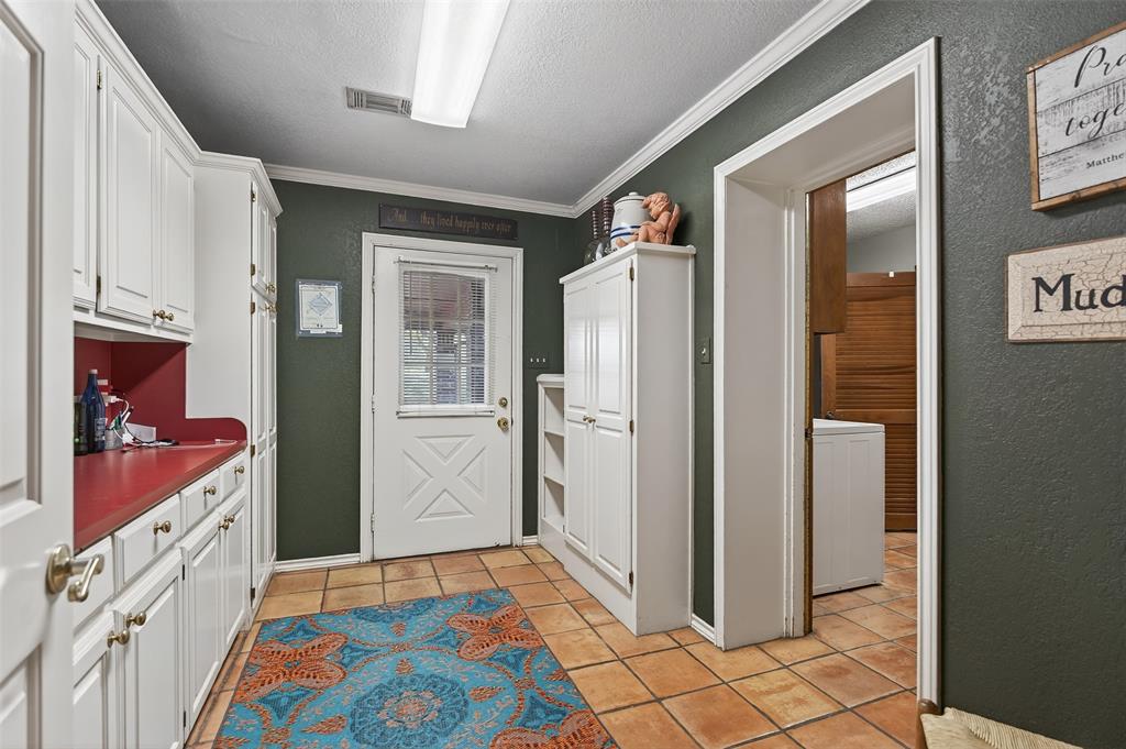 3030 Wager Road Flower Mound, TX 75028 - Photo 19 of 39 a bedroom with a bed and a dresser in it