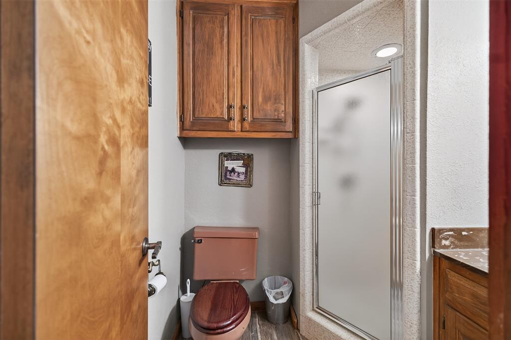 3030 Wager Road Flower Mound, TX 75028 - Photo 23 of 39 a bathroom with a toilet and a sink