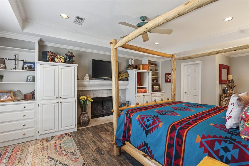 3030 Wager Road Flower Mound, TX 75028 - Photo 26 of 39 a bedroom with bed and cabinets