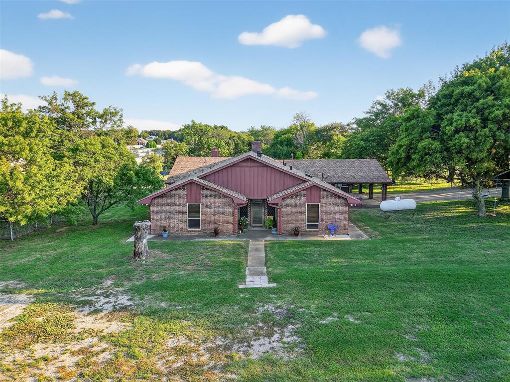 3030 Wager Road Flower Mound, TX 75028 - Photo 30 of 39 a front view of a house with garden