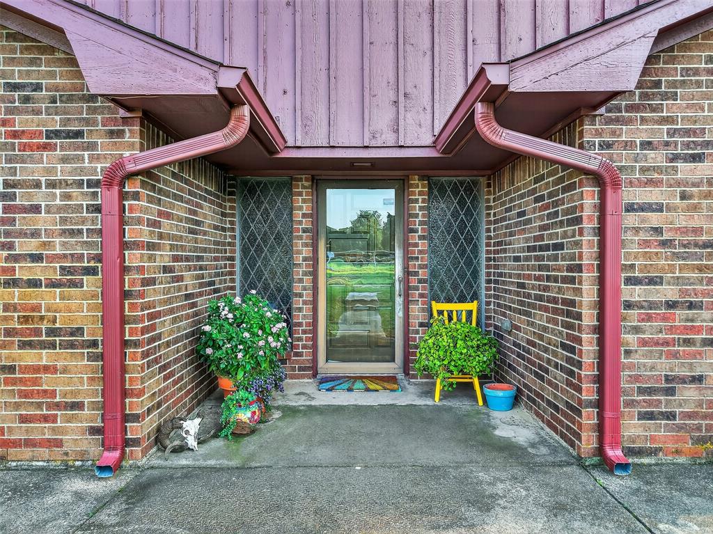 3030 Wager Road Flower Mound, TX 75028 - Photo 31 of 39 a front view of a house with garden