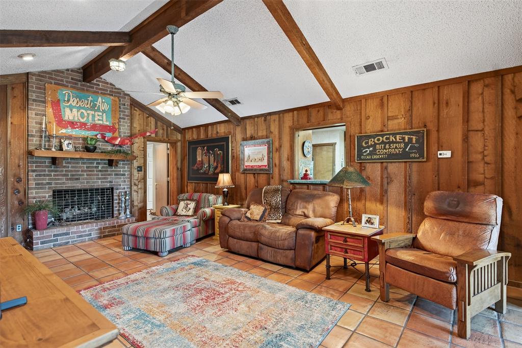 3030 Wager Road Flower Mound, TX 75028 - Photo 10 of 39 a living room with furniture a fireplace and a large window