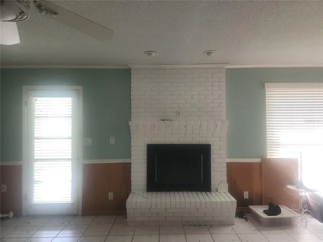 a kitchen with kitchen island cabinets and refrigerator
