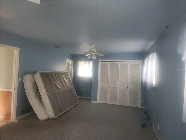 a room with furniture and a window