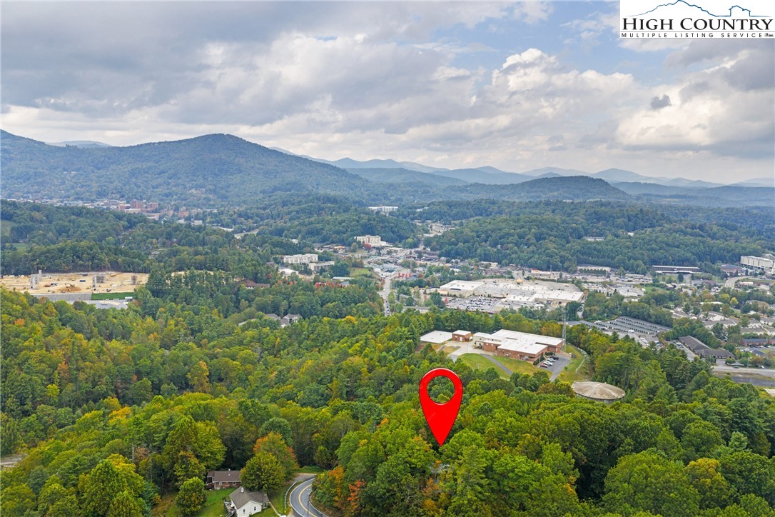 547 Deck Hill Road Boone, NC 28607 - Photo 11 of 50 a view of a lake with mountains in the background