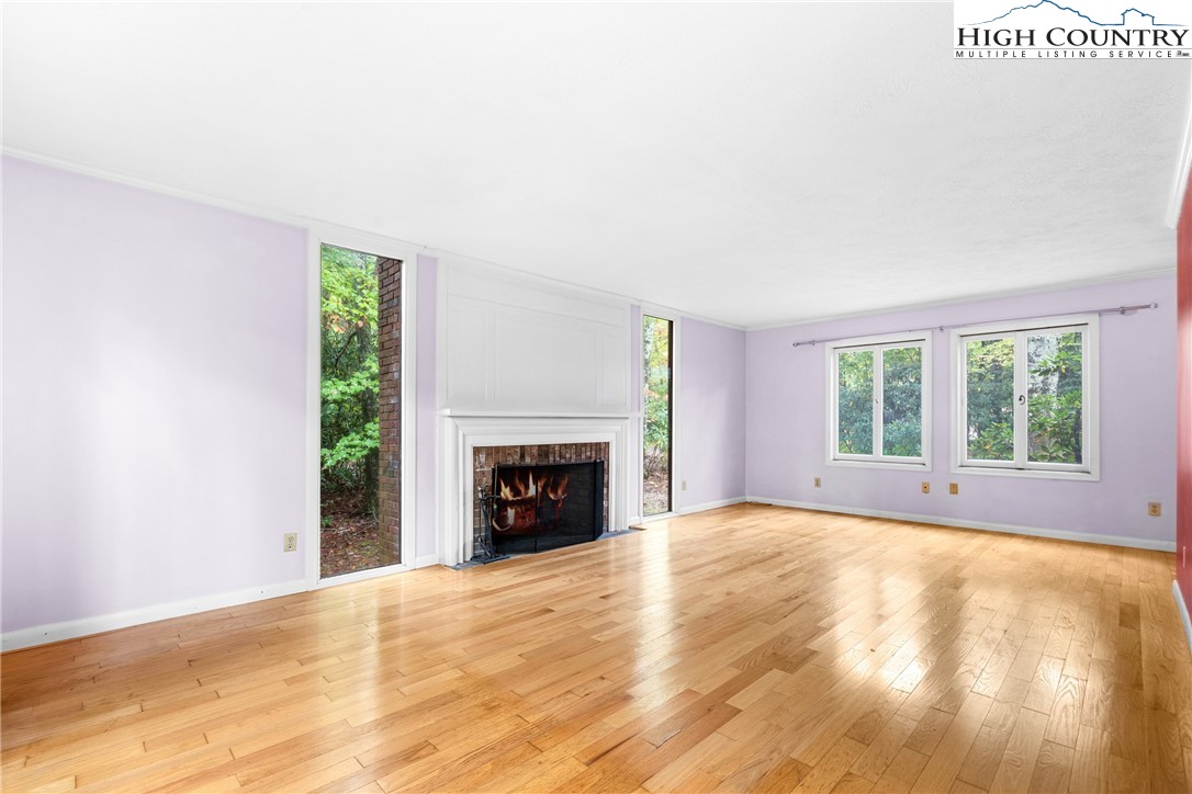 547 Deck Hill Road Boone, NC 28607 - Photo 15 of 50 a view of an empty room with wooden floor and a window