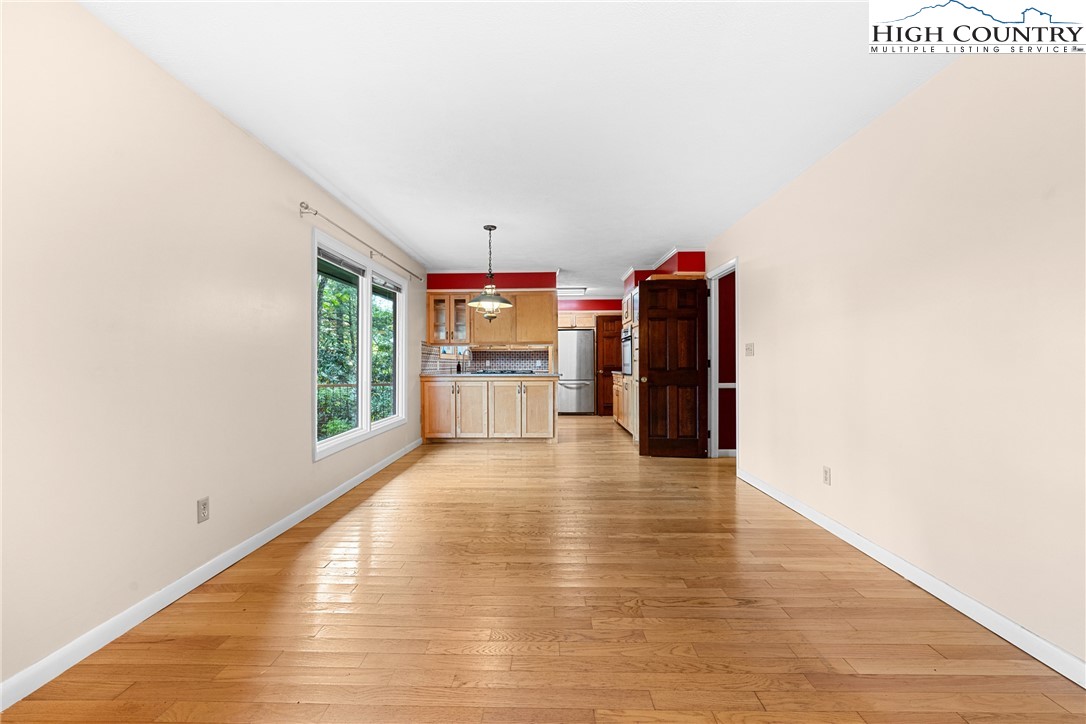 547 Deck Hill Road Boone, NC 28607 - Photo 20 of 50 a view of a livingroom with wooden floor and a large window