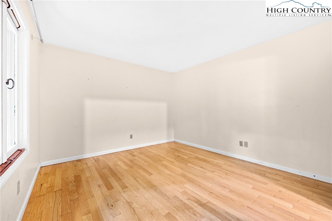 547 Deck Hill Road Boone, NC 28607 - Photo 25 of 50 a view of empty room with wooden floor