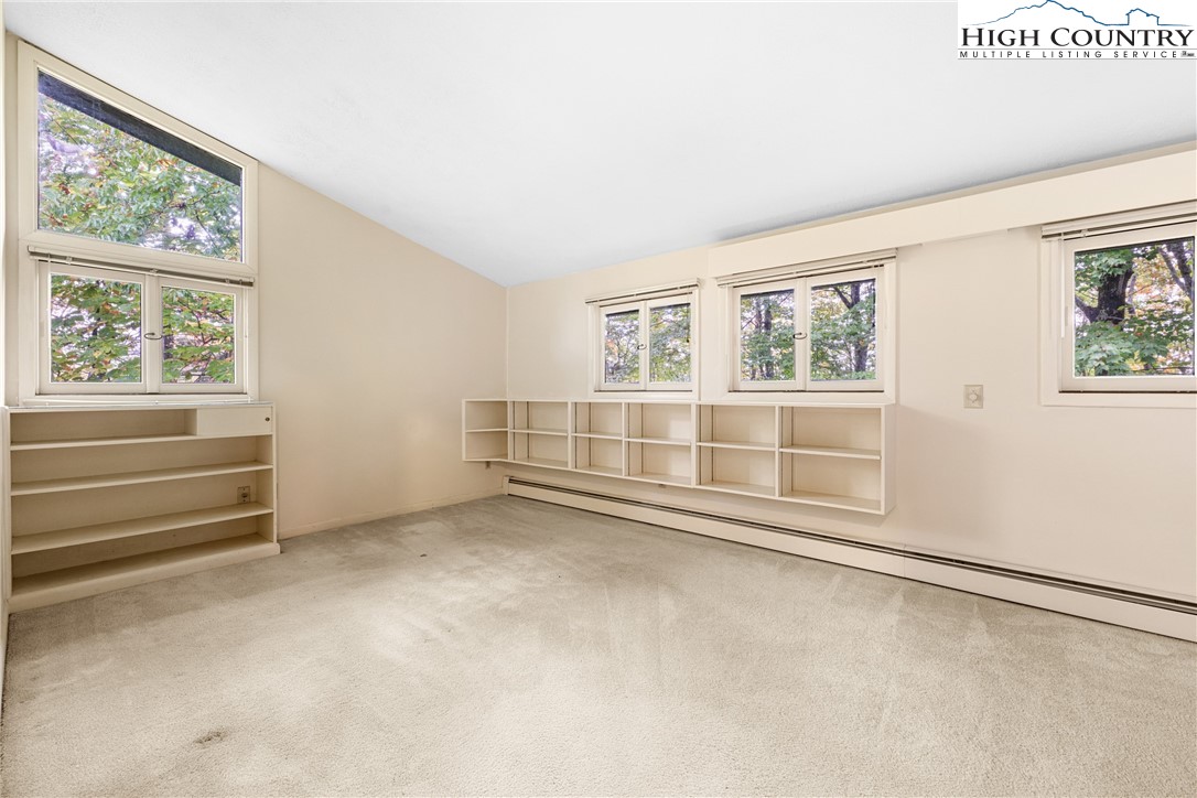 547 Deck Hill Road Boone, NC 28607 - Photo 29 of 50 an empty room with windows